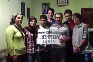 Mehment (centre back) and some of his family with my last hitch-hiking sign