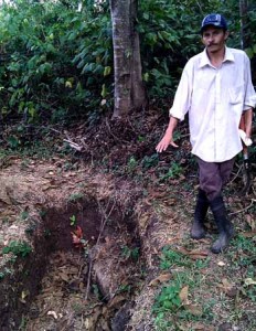 Efren and a small water retaining trench, that also slows destructive run-off in the wet season