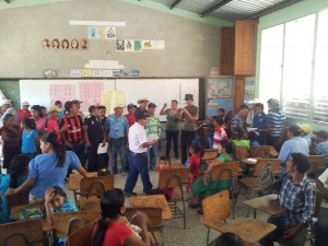 The meeting was well attended, with over a hundred people some of whom had walked for 4 hours to be there. Here the group are participating in a discussion of the ILO{s convention 169 on Indigenous rights, and what it means to them