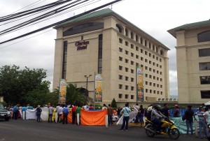 The marchers settled outside the closed doors of the Mining Congress, at the Clarion Hotel